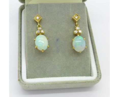 A pair of 18ct gold, opal and diamond earrings