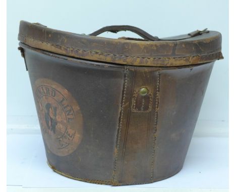 A leather hat box with Passengers Baggage Inspector's Pass ticket to base with associated photograph, S.S. Servia