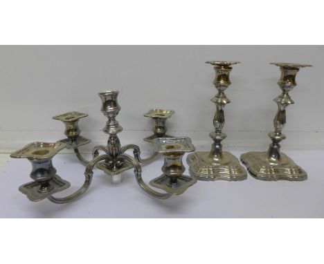 A pair of silver candlesticks with a plated four branch candelabra top, candlesticks 18cm