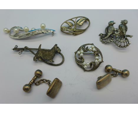 Five brooches including silver and a pair of Victorian silver cufflinks
