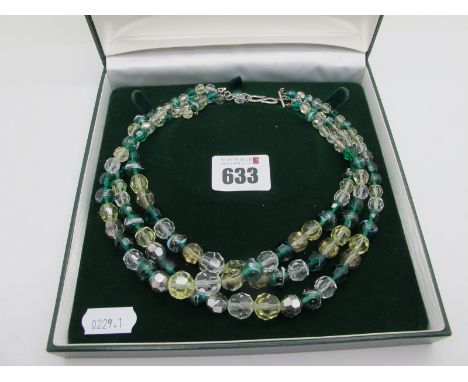 Christian Dior; A Vintage Three Row Bead Necklace, green and white, to elongated 'S' hook, the small oval panel stamped "Chri