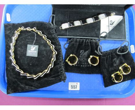 Swarovski; A Modern Gilt Metal and Black Enamel Panel Bracelet, boxed; Together with A Necklace, and two pairs of clip on ear