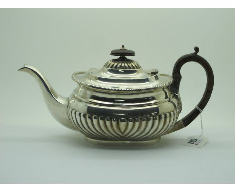 A Hallmarked Silver Teapot, SWS&amp;Co, London 1901, of semi reeded form, with ropetwist edge (700grams). 