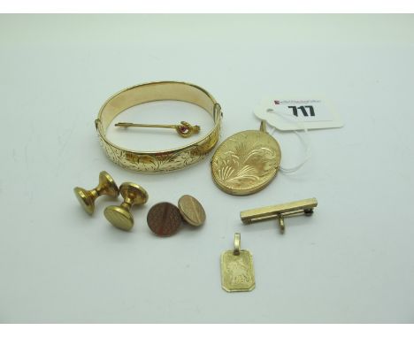 A Large Oval Locket Pendant, engraved to the front, stamped "Rolled Gold", together with a rolled gold hinged bangle, bar bro