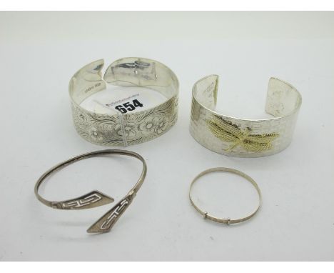 A Decorative Hallmarked Silver Wide Bangle, with foliate decoration, a modern wide bangle with dragonfly detail, a dainty chi