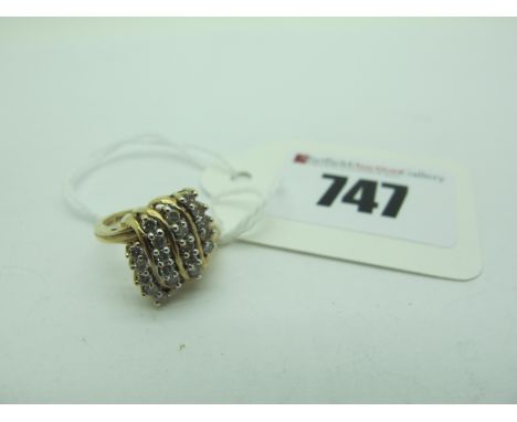 A Modern Diamond Cluster Ring, of abstract design, claw set throughout with brilliant cut stones, stamped "10KP" (finger size