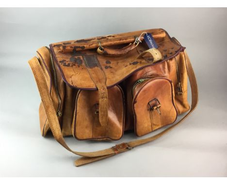 VINTAGE LEATHER TRAVEL BAG, containing a group of old hand tools