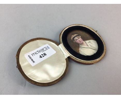 EARLY 20TH CENTURY MINIATURE PORTRAIT OF A LADY, pictured wearing a headband, 5.5cm x 4.5cm, framed and under glass, in leath
