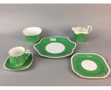 HEATHCOTE CHINA TEA SERVICE OF ART DECO DESIGN, comprising 11 cups, 12 saucers, 12 side plates, 2 cake plates, milk jug and s