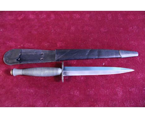 A Fairbairn Sykes commando fighting knife pattern 3 (faint 1 to pommel) WW2 issue with scabbard 