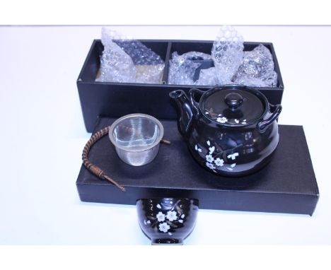 A boxed Japanese ceramic tea service 