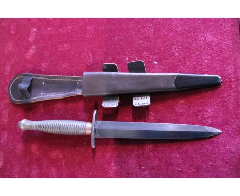 A Fairbairn Sykes pattern 3 commando fighting knife, No 3 to pommel (WW2 issue) and scabbard 