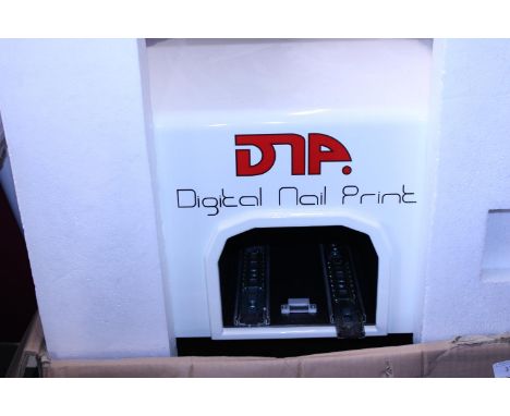 A boxed digital nail art printer (unchecked).  No postage 