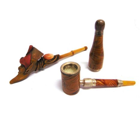 A NOVELTY SOUVENIR PIPE  the travel case in the form of a bottle of champagne, impressed 'Jerusalem', 14cm high; together wit
