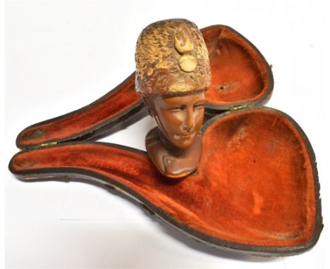 A MEERSCHAUM PIPE  carved in the form of a lady's head wearing a fusilier's busby and tunic, with a gold collar and a simulat