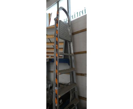A tall folding stepladder a small folding step up stepladder and a sack truck that converts to trolley and a small sack truck
