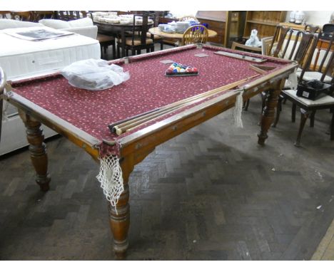 A Riley slate bed snooker table, 87" x 44", with red patterned baize complete with cues and a set of pool balls with marker 