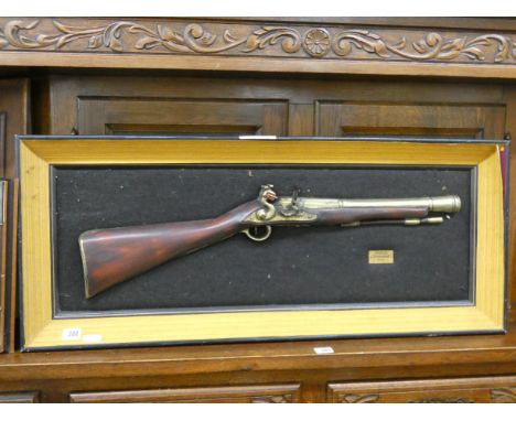 A piece of rope rigging from HMS Victory, blunderbuss wall ornament and a carved wood panel 