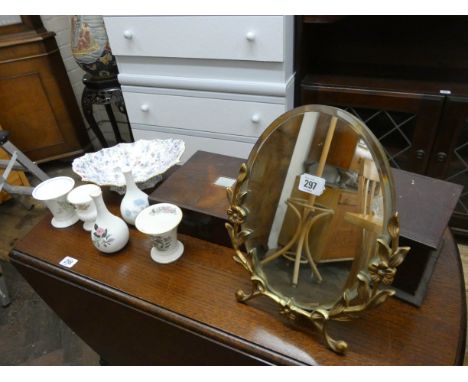 An easel style dressing table mirror in a gilt frame, various trinket boxes, decorative porcelain 