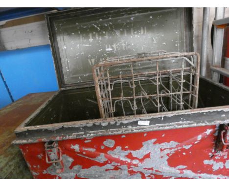 A large old metal trunk, old milk bottle crate and a smaller metal trunk 