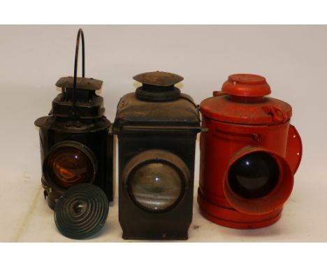 A Group of Oil-Lit Level Crossing and Other Lamps, three assorted lamps including Adlake crossing lamp, G, an Adlake amber la