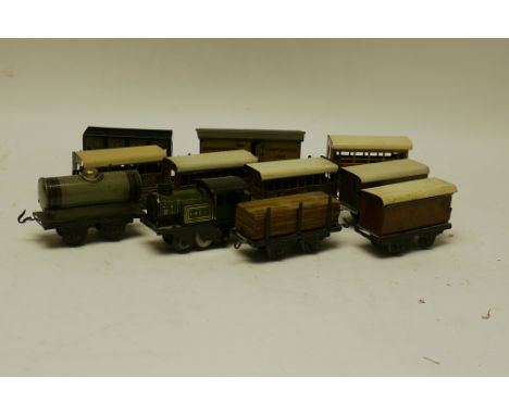 A Wells Clockwork O Gauge Locomotive with Bub or Similar Rolling Stock, the locomotive a pre-war LNER 0-4-0T with spiral-spri