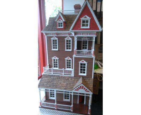 A large Craft Products Miniatures USA kit built San Francisco Dolls House, constructed in wood, four storey house with verand