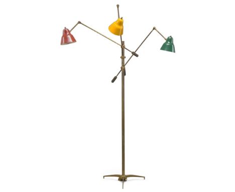 Italian, a brass three light standard lamp, In the manner of Stilnovo  c.1950  With three enamelled shades on adjustable bras