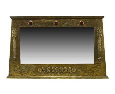 An Arts and Crafts brass framed over-mantel mirror with ceramic insets c.1905 The wood frame covered with brass riveted panel