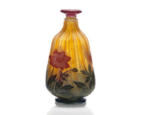 Daum, a cameo glass bottle with flower form stopper  c.1902, engraved Daum Nancy with Cross of Lorraine The bottle of rounded