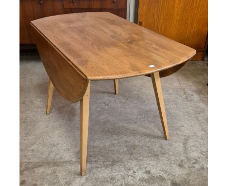 An Ercol Blonde elm and beech Windsor drop-leaf table 