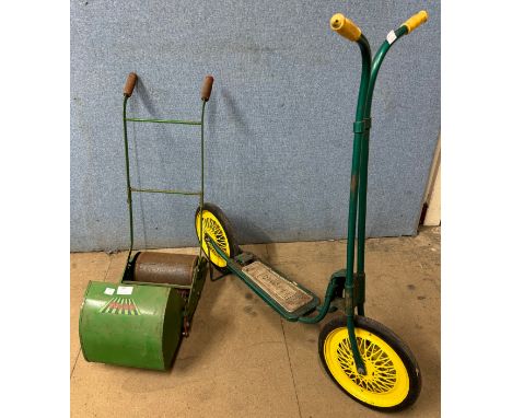 A Tri-ang child's scooter and a Webb child's toy lawnmower 