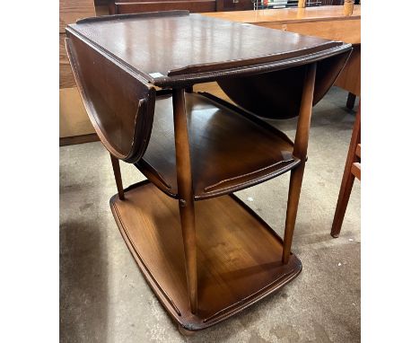An Ercol Golden Dawn elm and beech Windsor trolley 