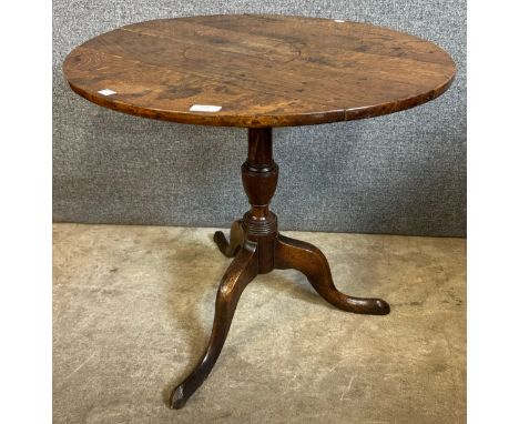 A George III oak circular tripod tea table 