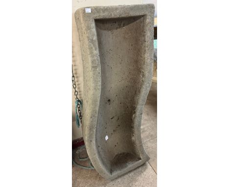A large concrete S-shaped trough 