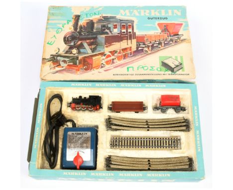 Marklin 3-rail HO Gauge Train set - Includes Locomotive, Hopper and tipper wagons, plus track and controller. Box has writing