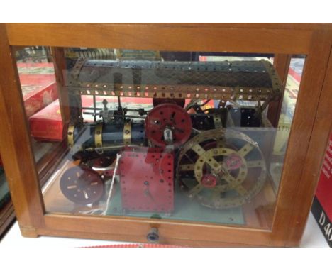 A large cased Meccano steam engine with working clockwork mechanism.