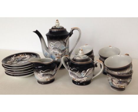 An oriental coffee set with painted Dragon & Flaming Pearl decoration.