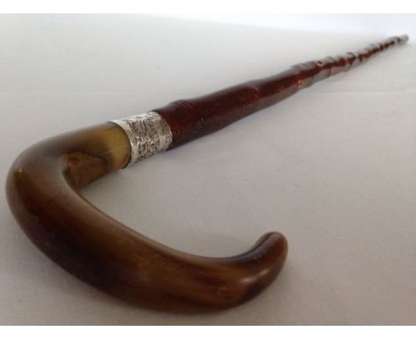 A vintage horn handled walking stick with HM silver collar.