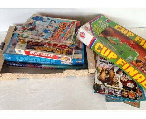 A box of vintage games & comics top include 1965 Waddingtons Spy Ring.