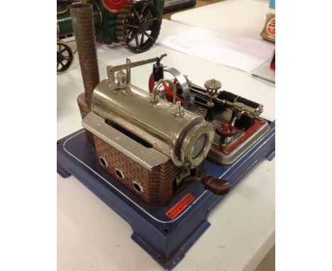 A German steam plant with stationary steam engine.