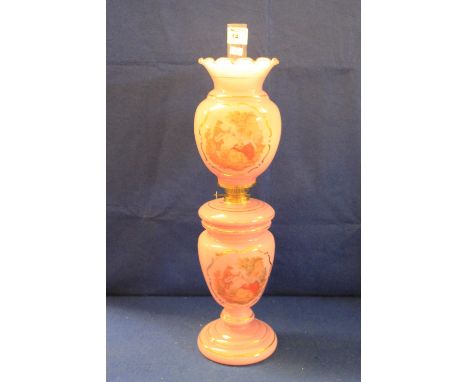 Victorian opaline pink glass oil lamp with panels depicting musicians and figures in garden scene raised on circular stepped 