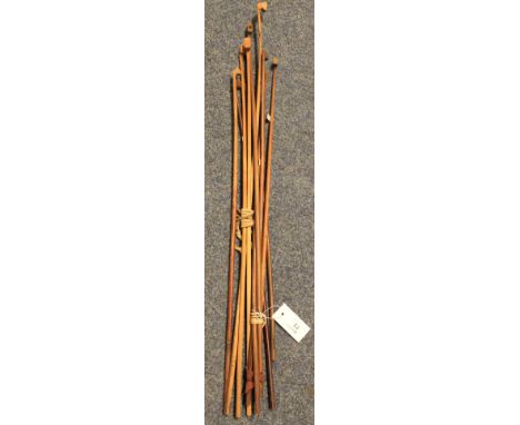 Collection of assorted violin or string instrument bows.