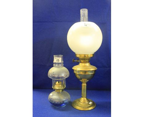 Early 20th Century brass double burner oil lamp together with similar smaller version with blue glass reservoir.  (2)
