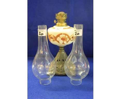 Early 20th Century oil lamp with floral cream, brown reservoir with two clear glass funnels.  (3)