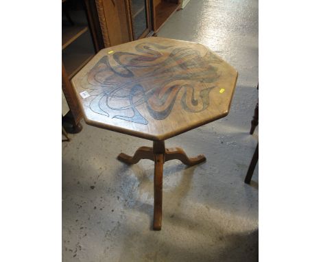 20th Century oak tripod hexagonal table with laquered organic decoration.