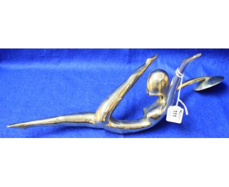 White metal sculptural candlestick in the form of a stretching female gymnast.