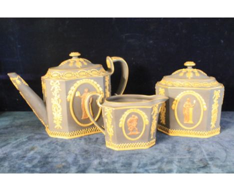 Three piece Wedgwood black basalt tea set, overall decorated with gilt swag, harp decoration with moulded mythological/musica