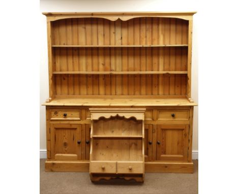 Solid pine dresser, projecting cornice, two tier plate rack, four drawers above four cupboards, plinth base (W182cm, H192cm, 