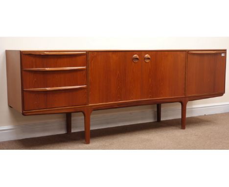 McIntosh teak retro sideboard, two cupboard doors enclosing fitted shelf flanked by three graduating drawers and a fall front